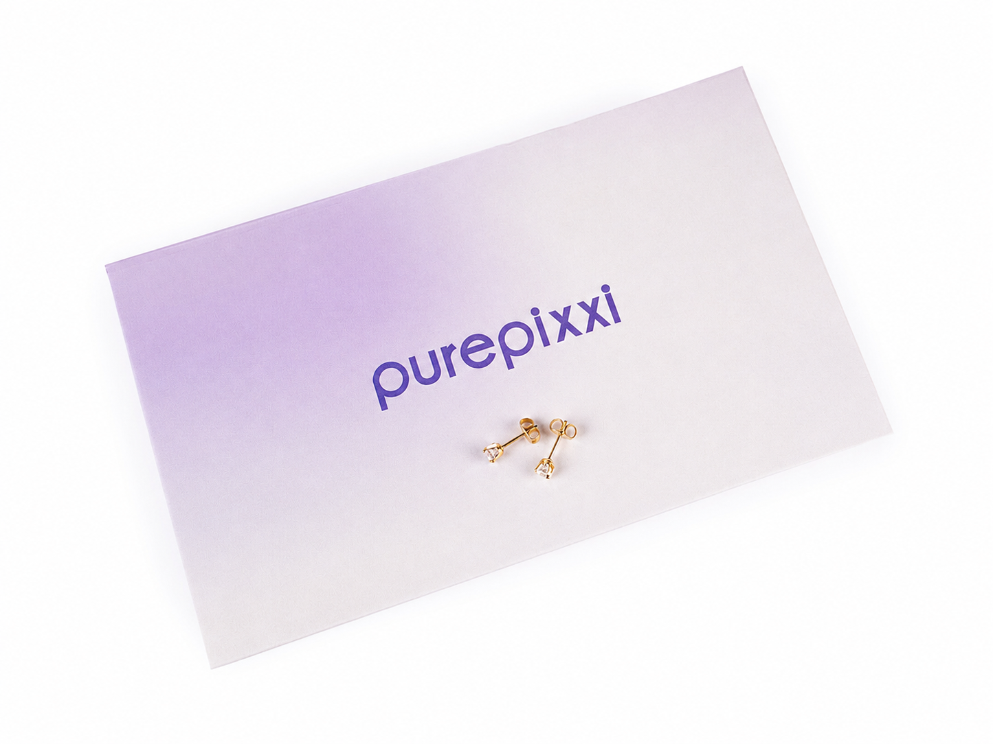 purepixxi stud earrings resting on branded purepixxi packaging for children's sensitive ears