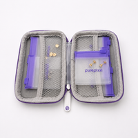 purepixxi Jewelry Case open, showing grey mesh compartments and pouches holding gold crystal stud earrings