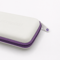 Close-up of the purepixxi Jewelry Case purple zip and embossed logo